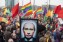 A demonstrator holds up a picture depicting Russian President Putin with make-up during a protest by the gay community in Amsterdam